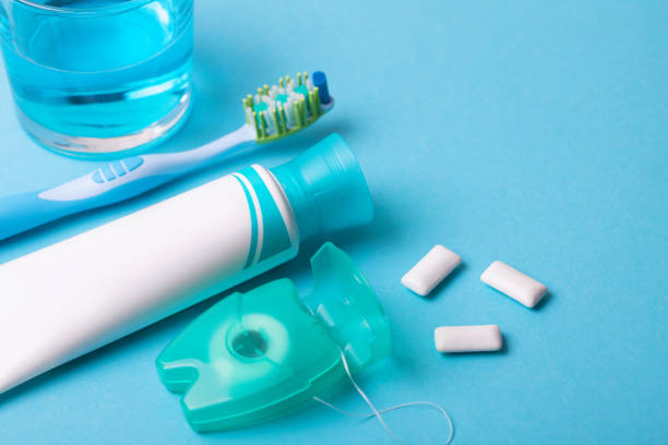 istock Tools for dental care: orthodontic brush, floss, toothpaste. Invisible dental aligners modern tooth brackets transparent braces to straighten teeth in cosmetic dentistry and orthodontics 1078185548