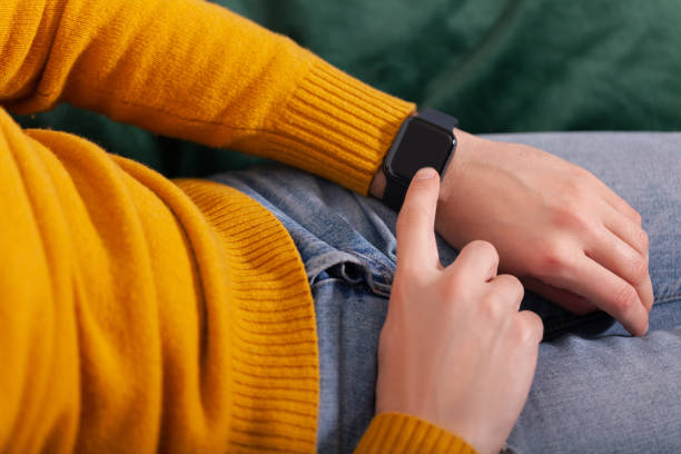istock Men's hand touching smart watch on top view. Can be used as mock up 1078185606