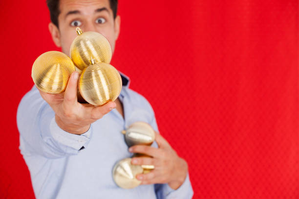 istock Man holding christmas balls 1078188570