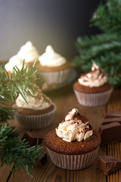 istock Chocolate cupcakes with whipped cream on rustic wooden table. Homemade dessert. 1078201772