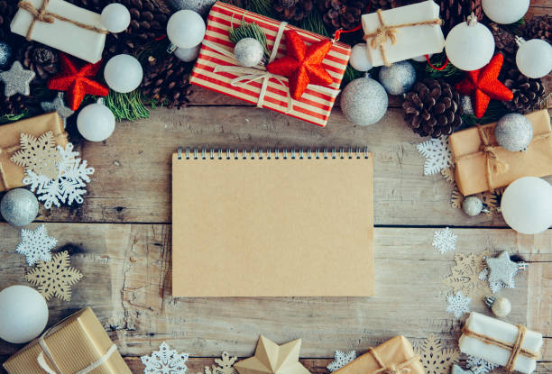 istock Christmas background with letter and gift boxes on the wooden ta 1078201840