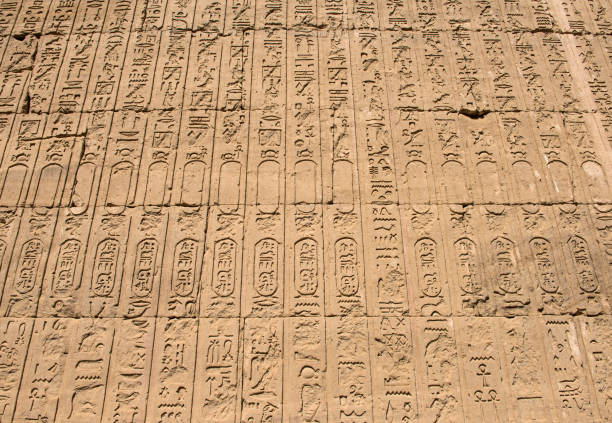 istock Hieroglyphic carvings on an ancient egyptian temple wall 1078204586