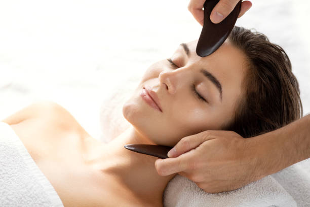 Woman during Chinese traditional massage - Gua Sha