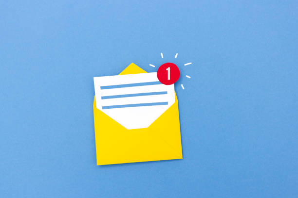 istock Creative paper composition of letter in envelope with counting icon showing one new message on blue background 1078212532