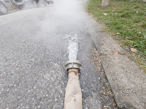 Drained hot water evaporates on citi street
