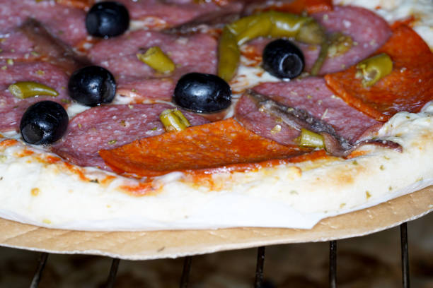 The today's, internationally widespread variant with tomato sauce and cheese as base probably originates from Naples.