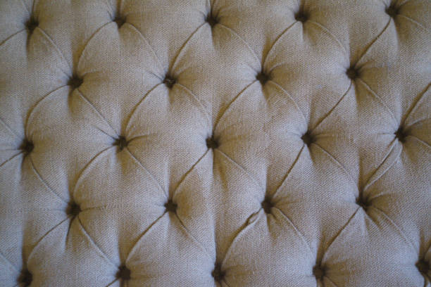 istock Texture of stained antique tufted couch 1078220858