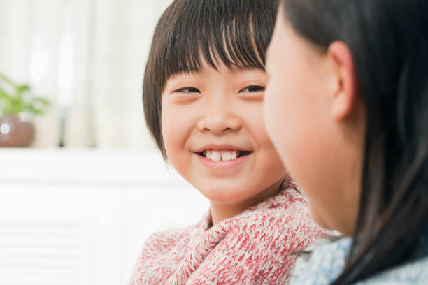 istock Chinese son sitting next to mother 1078229340