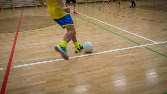 Indoor football in a sports hall.