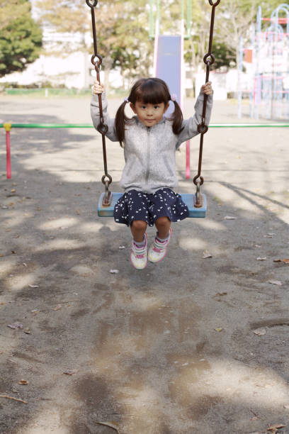 istock Japanese girl on the swing (4 years old) 1078230764