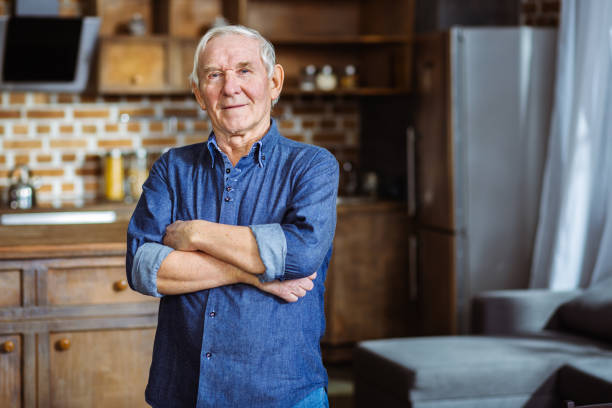 istock Positive elderly man standing in the kitchen 1078230978