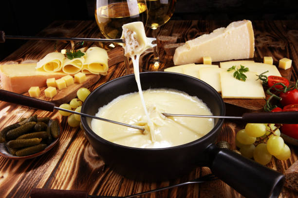 istock Gourmet Swiss fondue dinner on a winter evening with assorted cheese 1078231324