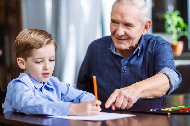istock Cute little boy enjoying drawing at home 1078231556