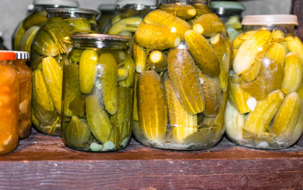 istock Glass jar with pickled cucumbers in grandma basement 1078232014
