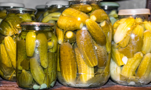 istock Glass jar with pickled cucumbers in grandma basement 1078232034