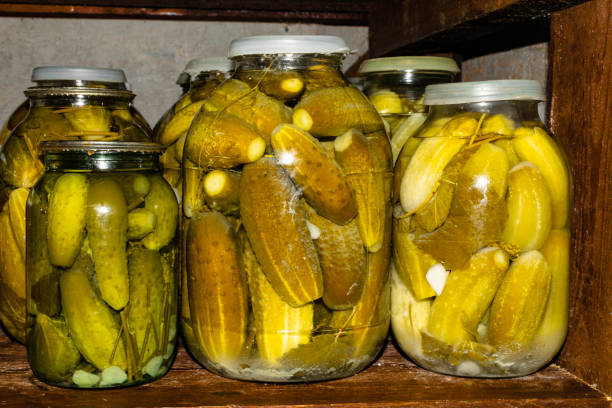 istock Glass jar with pickled cucumbers in grandma basement 1078232078