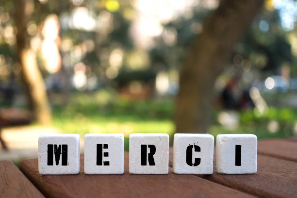 istock MERCI Concept with alphabet blocks on wooden table. 1078248934