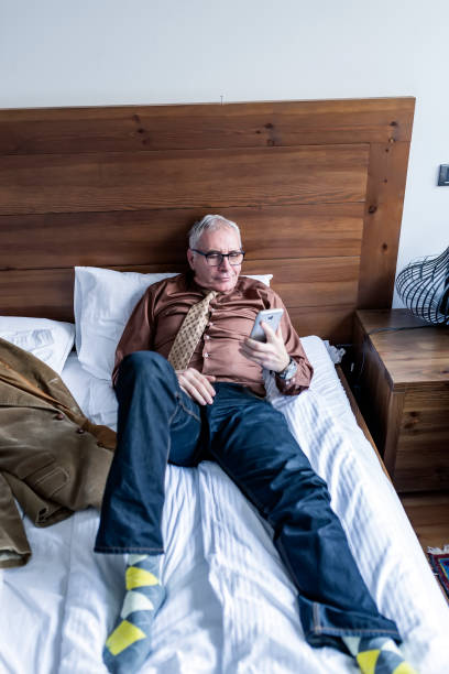 istock Businessman relaxing after work in bedroom 1078254410