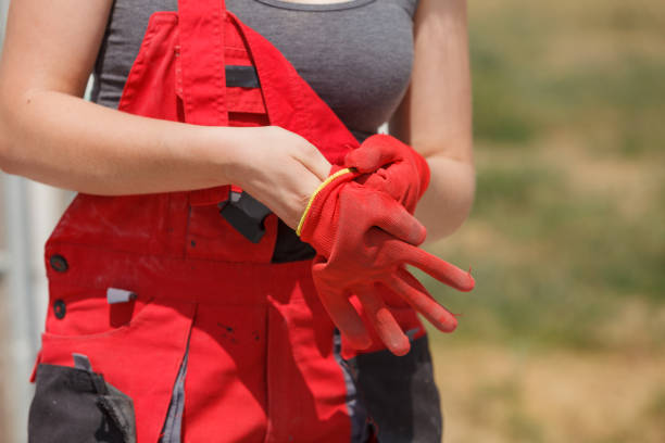 istock Woman putting safety worker gloves 1078254722