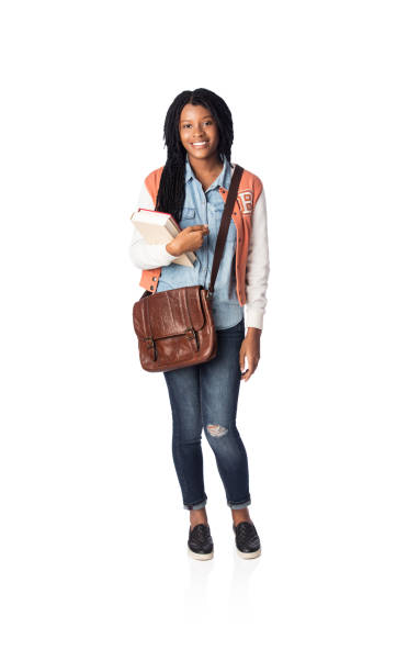 istock Lovely female student standing and smiling at camera 1078256526