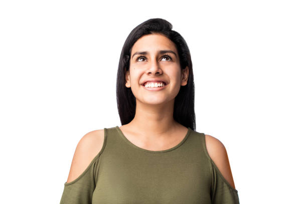 istock Lovely young woman looking up and smiling 1078258106
