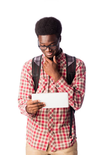 istock Young male student looking at digital tablet and smiling 1078259008
