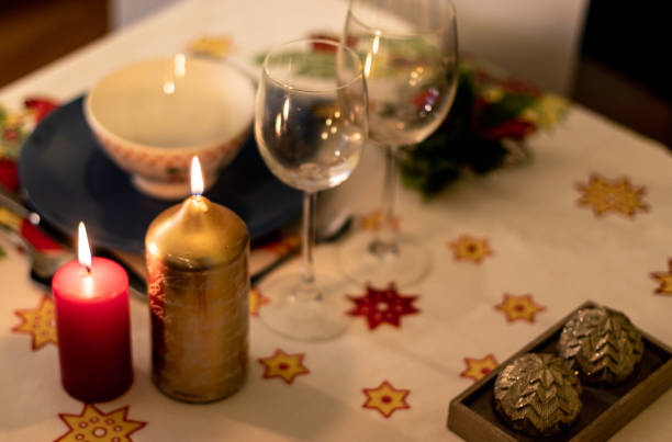 istock Christmas table with crockery, candles and decoration on tablecloth 1078259044