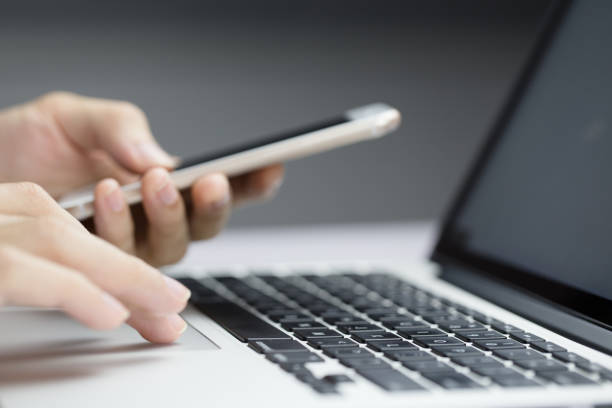 istock Businessman Using Smartphone And Laptop 1078260722