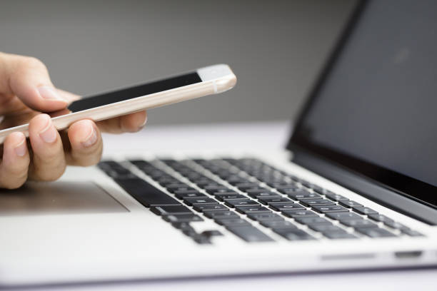 istock Businessman Using Smartphone And Laptop 1078260736