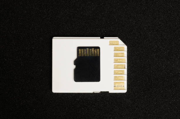 istock Memory card isolated on black background. secure digital card. copy space 1078265574