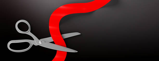 istock Scissors cutting red silk ribbon against black background, banner. 3d illustration 1078267868