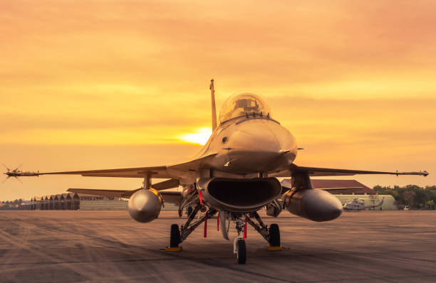 istock military fighter jet aircraft parked on runway on sunset 1078276808