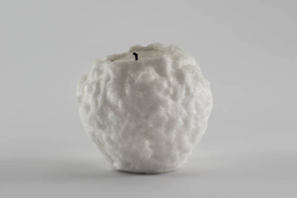Snowball shaped candle isolated