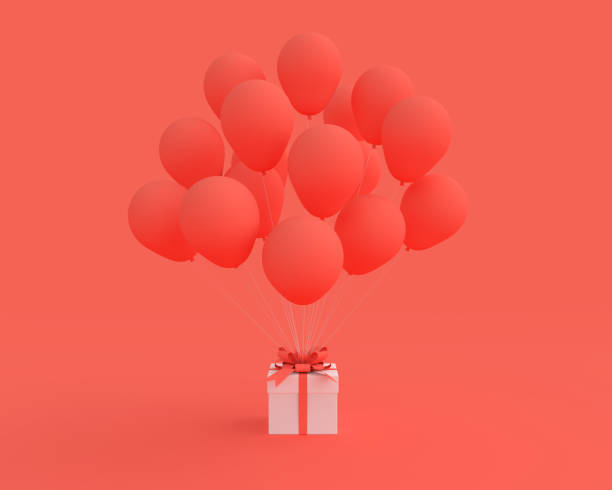 istock White gift box with balloon on orange background. 1078285534