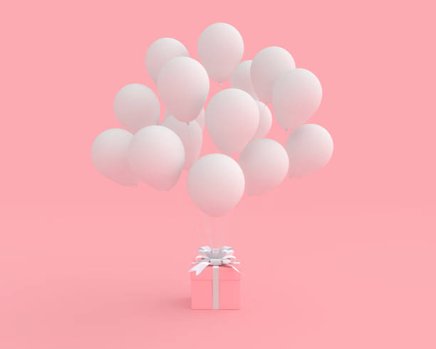 istock Pink gift box with balloon on pink background 1078285538