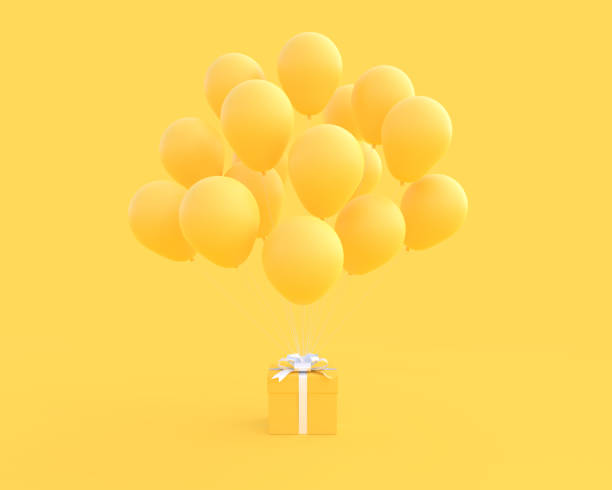 Yellow gift box and balloon on yellow background