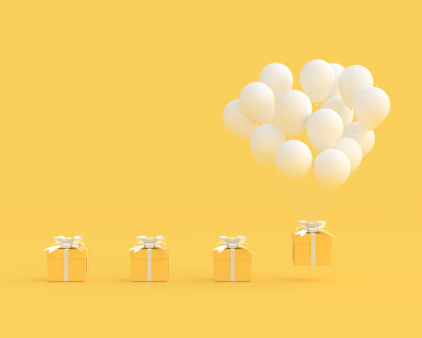 istock Yellow gift box with balloons on yellow background 1078285576