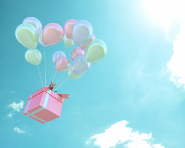 istock Pink gift box and balloons pastel color in sky 1078287574