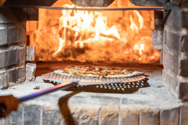 istock Pizza being baked at a Wood fire Brick oven 1078294698