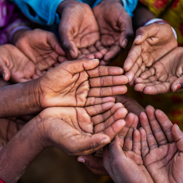 istock Hunger in Africa - hands asking for food 1078297154