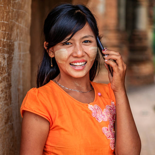 istock Young Burmese girl using mobile in Bagan, Myanmar 1078298800