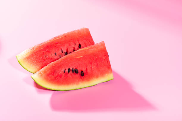 istock Watermelon cut into pieces and pink background 1078299264
