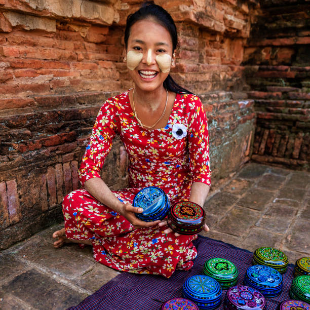 istock Young Burmese girl selling a lacquerware in Bagan, Myanmar 1078299280