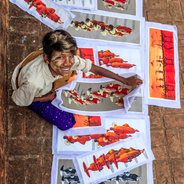 istock Young Burmese boy selling sand paintings in Bagan, Myanmar 1078300504