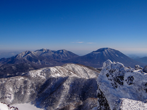 Mt.Shirane at Nikko ,Tochigi Pref.\nIn winter,Those mountains are   covered with snow and ice.