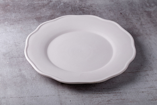 Empty white porcelain plate bowl isolated on the white background with clipping path
