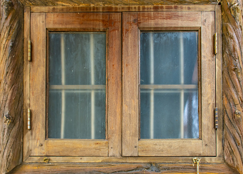 The window glass. Old wooden frame.
