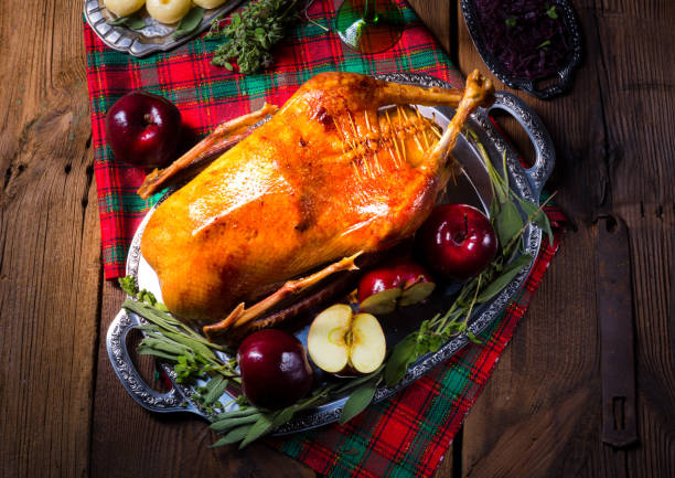 istock festive stuffed roast goose with red cabbage and dumplings 1078327000