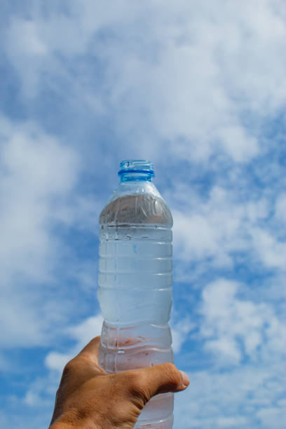 istock Drink water and bright blue sky. 1078327150