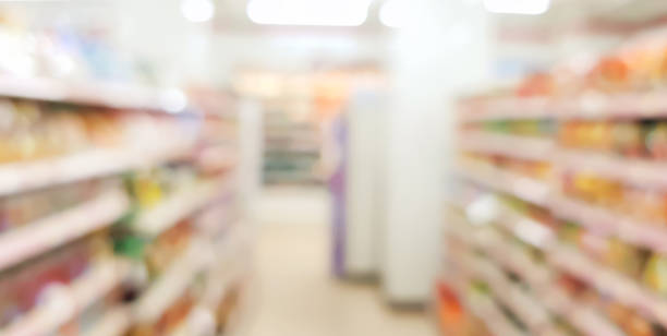 abstract blurred local supermarket aisle distribution and corridor background concept abstract blurred local supermarket aisle distribution and corridor background concept convenience store photos stock pictures, royalty-free photos & images